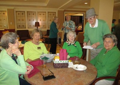 Park Place of Elmhurst residents celebrating Saint Patrick's Day in the Butterfield Dining Room